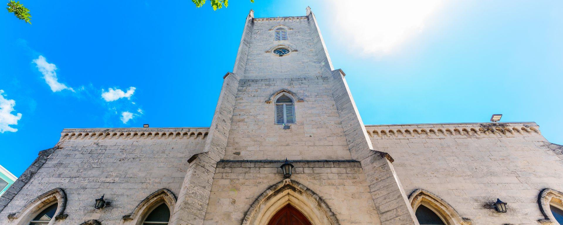 The stone tower and front of Christ Church Cathedral in Nassau, seen from below.